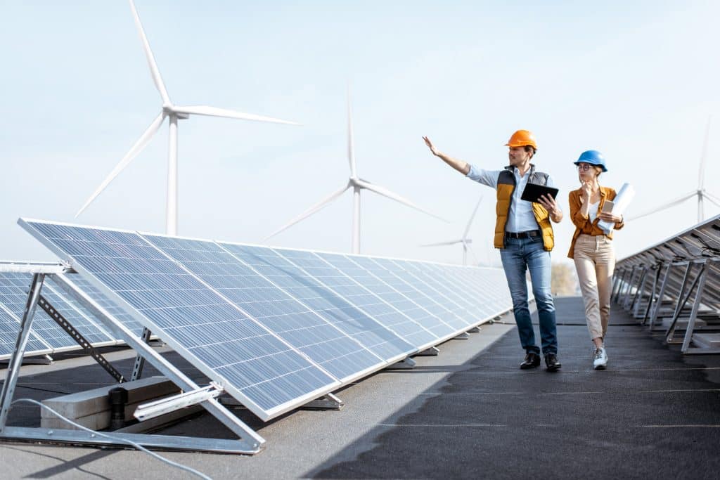 Two photovoltaic experts check the installation of a photovoltaic system.